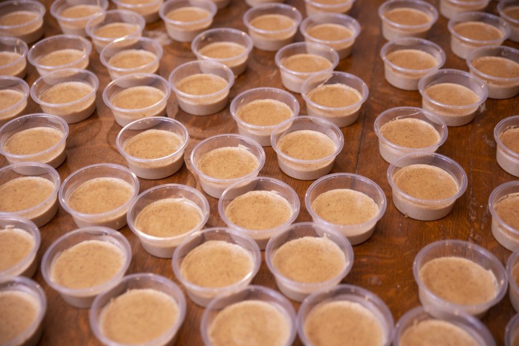 Multiple small containers of assida