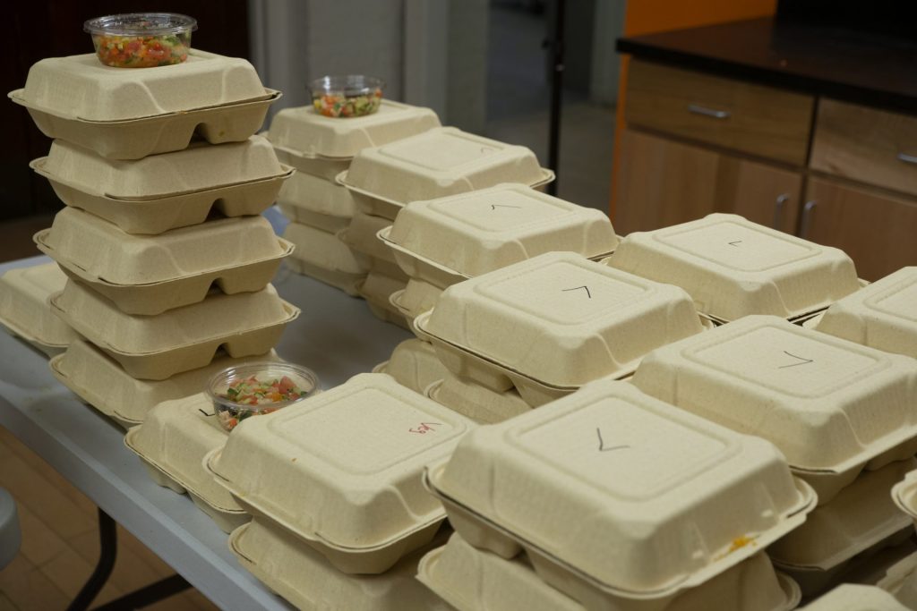 Stacks of cardboard clamshell packages