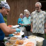 Food being served to a line of waiting people