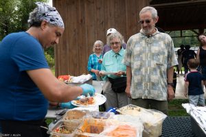 Food being served to a line of waiting people