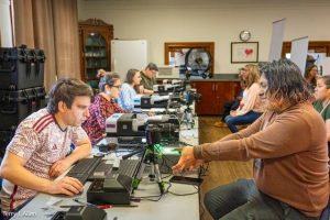 Staff helping people.