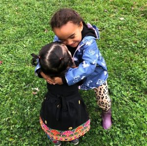 Two children hugging. Image: Irina Markova 2023.