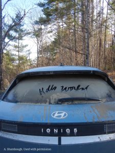 Someone wrote 'Hello World' on the rear windshield of a dirty car. Image: A. Shambaugh